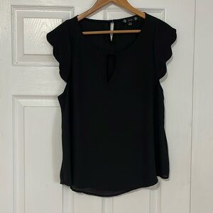 Black top with scalloped sleeves